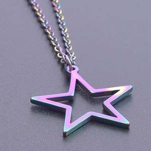 Macro shot of iridescent rainbow pentagram star pendant necklace in stainless steel
