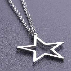 Macro shot of minimalist hollow star pendant made of silver stainless steel with chain