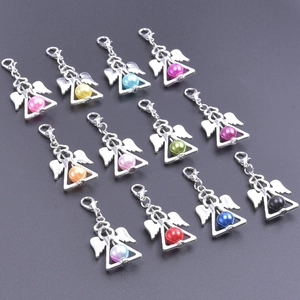 Detailed set of 12 colorful angel wing charms with lobster clasps and metallic finish