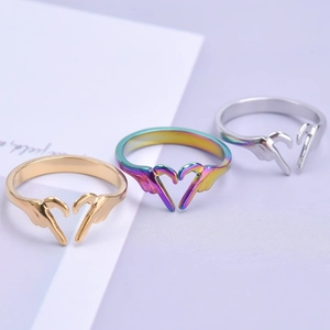Three open rings featuring hand-heart gesture in gold, silver, and rainbow colors