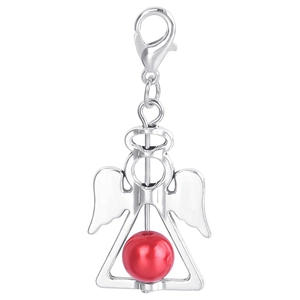 Macro shot of silver angel wing pendant with a red bead and lobster clasp