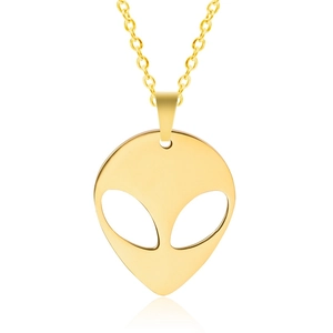 Macro detail of 18K gold-plated stainless steel alien pendant with hollow-out facial features