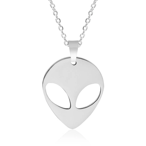 Close-up of polished silver alien head pendant with hollow eyes for DIY jewelry