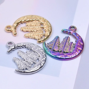 Detail of crescent moon pendants in gold, silver and rainbow finish with tree texture