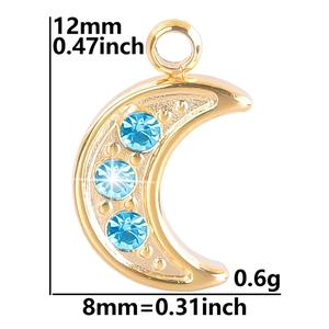 Macro shot of 18K gold moon pendant with light blue rhinestones and dimensions