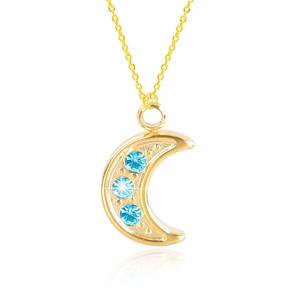 Detailed close-up of 18K gold crescent moon pendant with three blue rhinestones