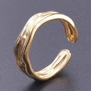 Detailed close-up of adjustable golden snake ring with irregular liquid lava texture design