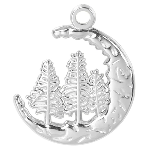 Macro shot of silver crescent moon and pine tree forest pendant in minimalist style