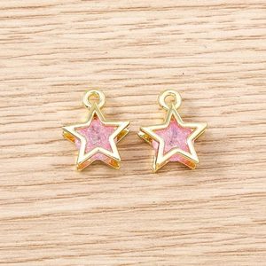 Detailed view of pink glitter pentagram star pendants for DIY jewelry necklaces