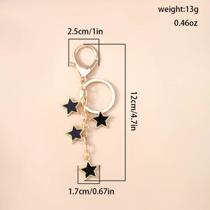Vue détaillée des dimensions du porte-clés étoile dorée avec pendentifs en émail noir