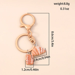 Detailed view of realistic bread keychain charms with accurate size and weight dimensions