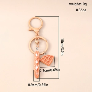 Detail view of baguette and waffle keychain with precise dimensions and weight specs