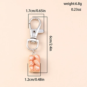 Detail showing bread keychain dimensions and 6.8g weight on a neutral background