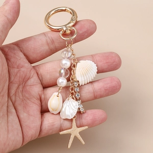 Modischer Schlüsselanhänger mit Muscheln, Perlen, Seestern-Anhänger und Strass-Quaste