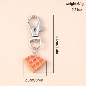 Detailed view of waffle keychain dimensions 6.2cm by 2.3cm with lobster clasp