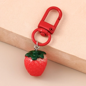 Realistic red strawberry keychain with green leaf and matching metal D-ring for backpacks