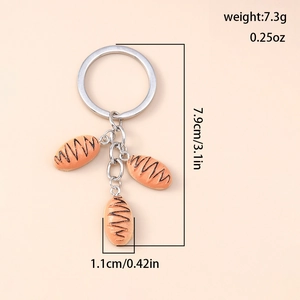 Detailed view of bread keychain with size dimensions and weight in grams and ounces