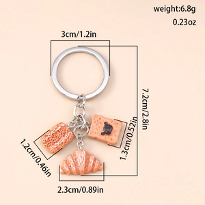 Detailed size chart for faux bread keychain showing dimensions of croissant and toast charms