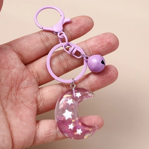 Purple resin crescent moon keychain with stars, metallic bell and lobster clasp hanging charm