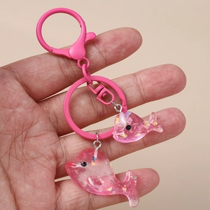 Portachiavi a forma di delfino in resina rosa con glitter e moschettone in metallo