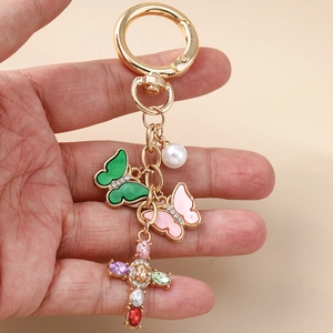 Modischer Schmetterling Schlüsselanhänger mit Perle und buntem Strass Kreuz auf Goldring