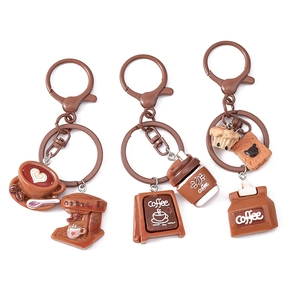 Three-piece coffee themed keychain set with resin espresso machine and cafe sign pendants