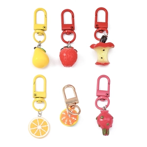 Set of 6 fruit-shaped keychains including dragon fruit and strawberry with D-ring clips