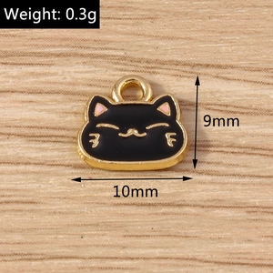 Detail of DIY black cat enamel charm with gold whiskers and 10mm size dimensions