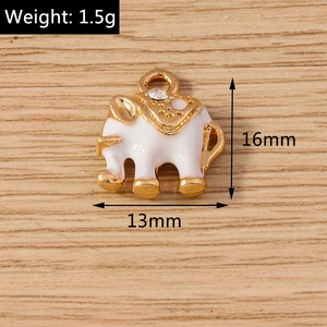 Detailed view of elephant charm pendant with white enamel and sparkling crystal detail