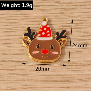 Detail of Christmas elk charm with red polka dot hat and golden ring for DIY jewelry