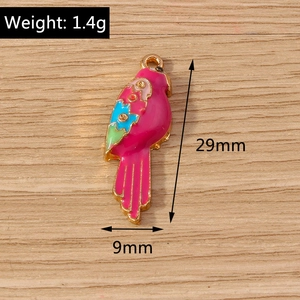 Detail of colorful parrot enamel pendant for DIY jewelry making with weight and size markers