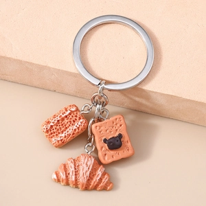 Detail of creative bread keychain featuring resin croissant and toast pendants