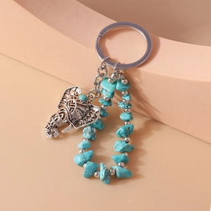 Ethnic elephant keychain with turquoise beads and hollow carved silver pendant
