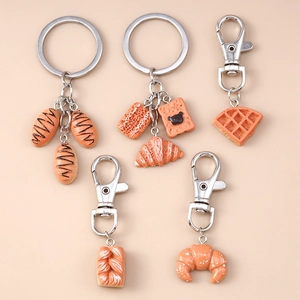 5-piece artificial food keychain set featuring baguette, croissant and waffle designs