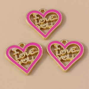 Detailed macro view of heart-shaped enamel charms with I Love You cutout for DIY jewelry