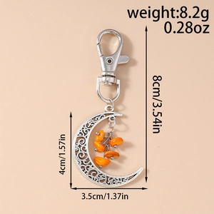 Detailed size specifications for crescent moon keychain with orange turquoise beads