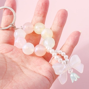 Sweet beaded bow keychain with gradient faux pearls and translucent resin bow pendant