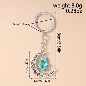 Detailed view of crescent moon keychain with turquoise stones and dimensions in cm
