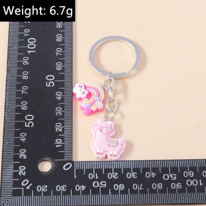 Pink alpaca and rainbow cloud keychain with silver ring measured at 6.7g weight