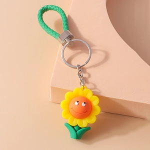 Porte-clés tournesol mignon avec visage souriant et dragonne en corde tressée verte
