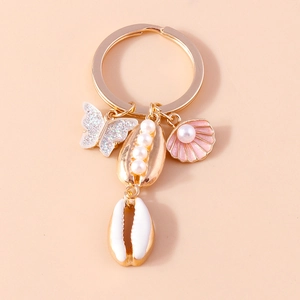 Detailed view of ocean theme keychain with butterfly, starfish and pearl shell charms