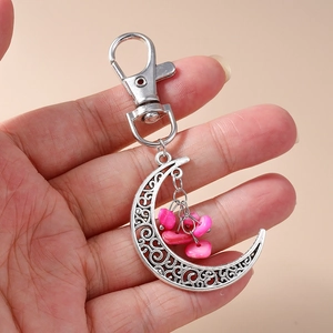 Ethnic hollow moon keychain featuring pink stone beads and silver alloy crescent pendant