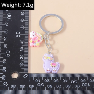 Detailed view of cute purple alpaca keychain with rainbow pendant and size measurement ruler