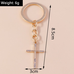 Detail showing dimensions of rhinestone cross keychain with 8.5cm length and 6g weight