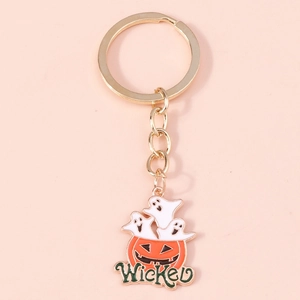 Detail of Halloween ghost pumpkin keychain with gold metal link and Wicked enamel pendant