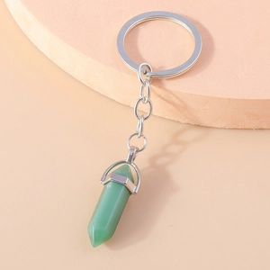 Detail of light green hexagonal crystal pendant keychain with polished silver metal link