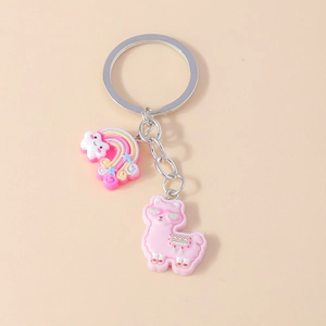 Close-up of pink alpaca and rainbow cloud keychain charms with a metal ring