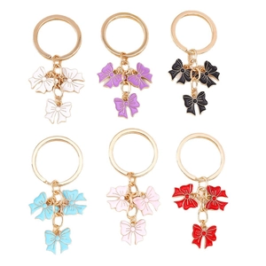 Creative bowknot keychain set in six colors with gold rings and enamel charms
