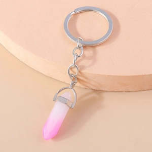 Detail showing gradient pink crystal hexagonal pendant on a silver metal keychain ring