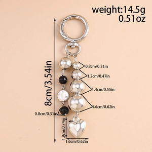 Detailed dimensions of silver and black beaded keychain with heart pendant and ring